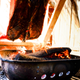 Illustration for article titled How To Roast A Whole Pig Over An Open Fire